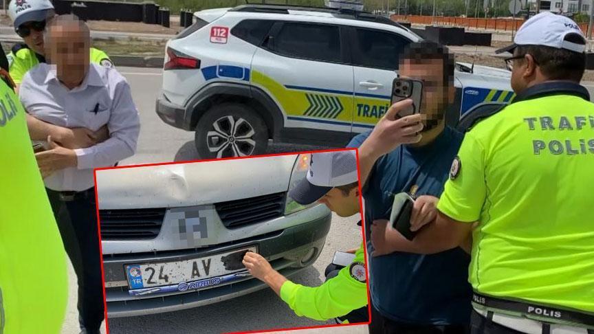 Plakasını bantla kapatan baba ve oğlu polis ablukaya aldı! Şoke eden savunma