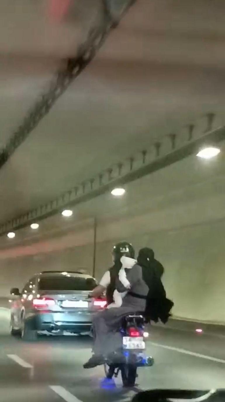 Avrasya Tüneli'nde tehlikeli seyahat: 1'i bebek 3 kişi motosiklet üzerinde 2 avrasya tunelinde tehlikeli seyahat 1i bebek 3 kisi motosiklet uzerinde 0